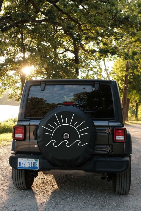 Sun and Wave Only JL Backup Camera Tire Cover Exclusive design to The Tire Cover Shop made by our designers. Tire covers are of exceptional quality, made from heavy-duty marine weight vinyl and a crisp printed design. Fits all vehicles with a spare tire. Please provide your tire size in the notes section as it is printed on your tire if you don't see yours listed. The primary color is the color of the tire cover. Free shipping to the US! Will withstand weather and car washing. Please read the po Jeep Wrangler Tire Covers, Jeep Bronco, Jeep Spare Tire Covers, Jeep Tire Cover, Jeep Wrangler Accessories, Wrangler Accessories, Adventurous Women, Spare Tire Covers, White Cover