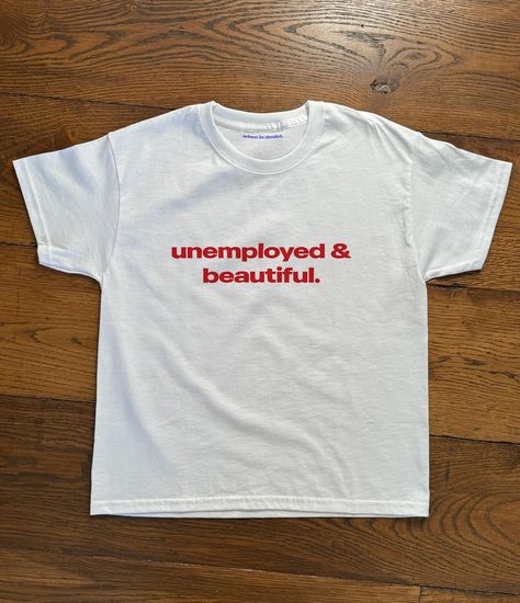 unemployed & beautiful. new baby tee design just added to the site ☆ Unemployed And Beautiful, Graphics T Shirts, August Outfits, Funny Baby Tees, Silly Shirt, Slogan Shirts, Baby Tees, Weird Shirts, Funny Tee Shirts