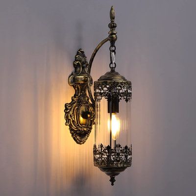 This wall sconce made in gold metal light body and vintage-inspired design makes the wall lamp full of rustic atmosphere. With a cylindrical lamp body and cylindrical glass shade, average lighting distribution, and nicely fits all kinds of indoor or outdoor lighting needs. it is not only lighting but also a beautiful decoration for space. Shade Color: Transparent | World Menagerie Gibsonburg Iron Barn Light Wall Sconce Glass / Metal | 19 H x 4 W x 4 D in | Wayfair Modern Candle Sconces, Black Wall Lights, Rustic Light Fixtures, Vintage Wall Sconces, Rustic Wall Sconces, Indoor Lighting Fixtures, Rustic Lamps, Industrial Vintage, Living Room Mirrors