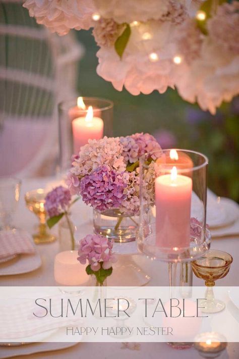 Create this romantic outdoor summer table. This table is all about pretty hydrangeas and paper flowers. It is the perfect table for a special occasion or a wedding reception. You won't want to miss how easy it is to create this dreamy outdoor table. Pink Flower Table Decorations, Wedding Vignettes, Simple Party Table, Pink Table Decorations, Pink Table Settings, Pink Tablescape, Summer Flower Arrangements, Summer Table Settings, Engagement Dinner