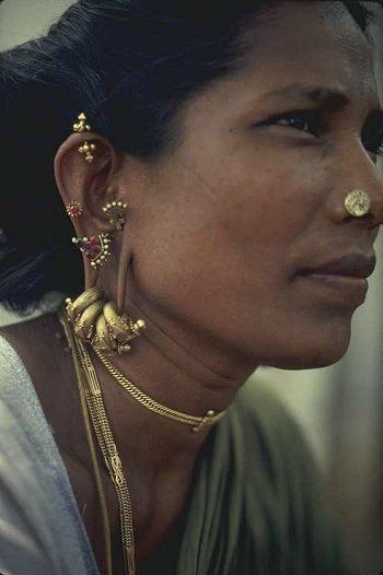 India |  Portrait of a village woman, with her lovely jewellery.  Photo taken in Madurai, Tamil Nadu. | Photographer unknown Madurai, Religious Dress, Bengali Jewellery, Dr Shoes, Body Modification, Indian Aesthetic, Traditional Jewelry, Tamil Nadu, Lovely Jewellery