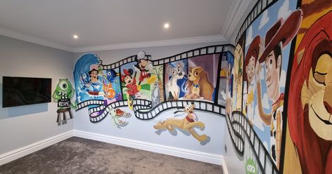 Disney painted mural for children's tv room pluto monsters inc Disney Feature Wall, Disney Painted Wall Mural, Movie Murals Wall Art, Disney Room Painting, Lilo And Stitch Themed Nursery, Cartoon Mural Wall Art, Disney Wall Art Ideas, Disney Collage Wall, Disney Play Room