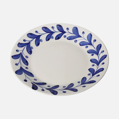 Inspired by intricate olive decorations found on antique Greek ceramics, Anna boasts a painterly motif that is simplistic yet quietly impactful. Handpainted in Portugal by artisans, this lively plate is the perfect entree into decorative tableware. Founded by textile designer Carolina Irving and her two daughters, the eponymous brand collaborates with artisans across the globe to curate ceramics with rich stories. Due to the handmade nature of this piece, slight variations may occur. Olive Decoration, Olive Decor, Greek Ceramics, Carolina Irving, Olive Dishes, Greece Art, Simplistic Style, Greek Pottery, Greek Dishes