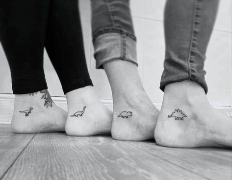 Meaningful Group Tattoos, Small Dinosaur Tattoo Matching, Five Matching Tattoos, Small Matching Tattoos 4 People, Sibling Dinosaur Tattoo, 3 Small Matching Tattoos, Sibling Wolf Tattoos, Tattoo Idea For 4 Friends, Tattoo Ideas For Roommates