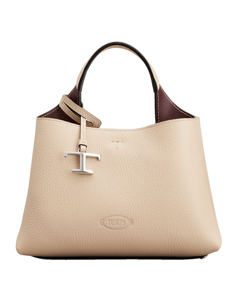 Tod's top handle bag in calf leather  Top handle with removable T logo charm  Detachable, adjustable shoulder strap Can be worn as a top handle or shoulder bag  Open top with lobster clasp closure  Center zip compartment divides interior Feet protect bottom of bag  Approx. 6.6"H x 9.8"W x 5.7"D Made in Italy Manolo Blahnik, Tods Bag, T Logo, Open Top, Handle Bag, Leather Top, Lifestyle Brands, Top Handle, Calf Leather