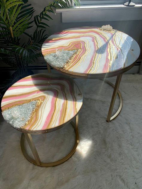 "MADE TO ORDER - One of a kind luxury geode crystal decorative nesting tables. Handmade design with high quality resin and colors of your choice. Perfect statement piece or gift. Imagine what a conversation starter these tables would be in your home ✨ These nesting tables include both real quartz points and resin quartz points. Each order is custom made with your color choices. Message me with any special requests. (White , gold, and rose pink is shown with painted metal gold legs) There will be Resin Table With Lights, Rose Quartz Coffee Table, Small Resin Table, Resin Coffee Tables, Resin Art Table Top, Apoxy Tables, Resin Center Table, Resin Wall Art Home Decor, Crystal Table Decor