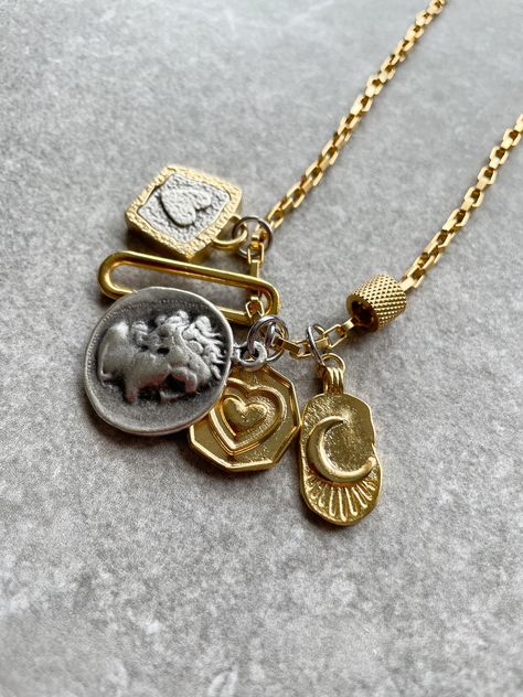 Handcrafted  by IJ Design Boutique 🤍🌟 High quality , unique and modern necklace with heart charms, Greek coin pendant mixed metal trendy necklace. Long 18k gold plated chain. Made of: * 18k gold plated  * Stainless steel  * 18k gold plated heart charms  * 18k gold plated clasp * Anti-allergenic * Long lasting Length customised. -IJ DESIGN BOUTIQUE- From necklaces to earrings, we make jewellery using a wide range of materials. From silver and gold plated to freshwater pearls and real gemstones. Mixed Metal Charm Necklace, Gold And Silver Jewelry Together Mixed Metals, Necklace Old Money, Greek Coin Pendant, Gold Long Chain, Mixed Metal Necklace, Ancient Greek Coin, Modern Necklace, Mixed Metal Earrings