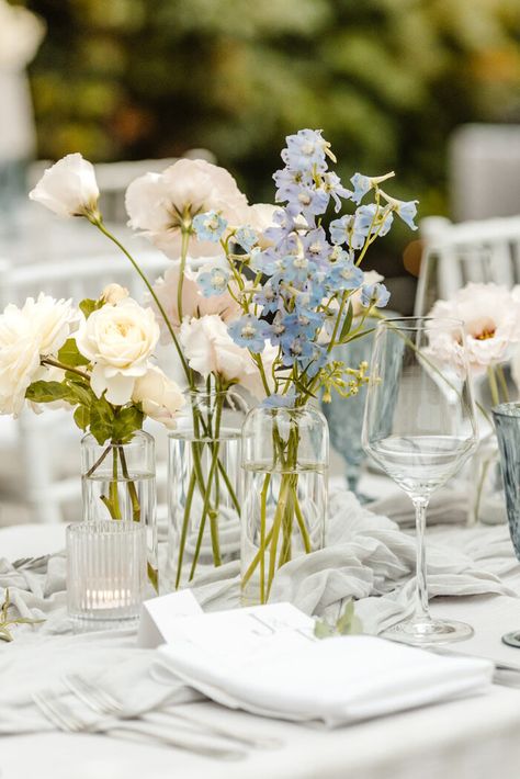 bud vase flowers blue, white, blush on grey table linens, fox hollow farm wedding venue near seattle, WA, wedding photographer Blue Vase White Flowers, Minimal Floral Wedding Decor, Light Blue And White Wedding Table Decor, Flower Inspo For Wedding, Soft Colors Wedding, Hydrangeas In Bud Vases, Pastel Color Table Setting, Stock White Flower, Blue Flower Table Decorations