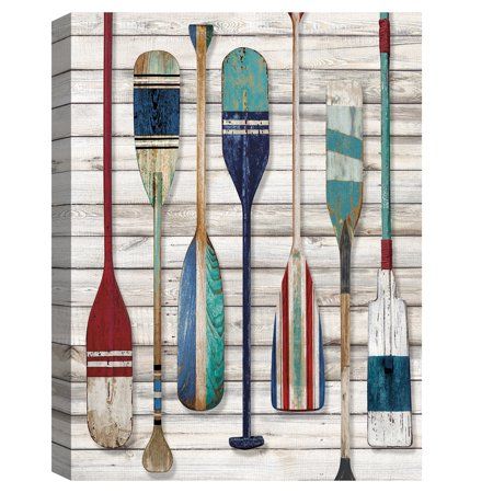 Boat paddles of all different colors and styles and displayed neatly against a weathered wooden backdrop. If youre looking for the perfect piece for your garage, entranceway, or hallway, display this piece where you store your boating gear! Its lovely accent if sure to tie your interests to your home dcor. The rich color saturation and intricate detail depicted in this piece is evidence of the exceptional printing technology used on top-of-the-line canvas. Additionally, since the print wraps aro Painted Oars, Paddle Decor, Oar Decor, Painted Paddles, Wooden Backdrop, Boat Oars, Masterpiece Art, Wooden Backdrops, Haus Am See