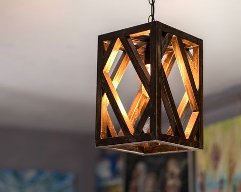 "The unique hanging lamp with warm light and beautiful shadows, made from planks of pine wood 2x2cm (0,8\"x0.8\") each one. If you are looking for unique decor item which is practical at the same time, You can not miss this wooden pendant lamp. You will be delighted how good this lamp looks at your home and how cozy atmosphere it makes in the evenings thanks to the warm light. This natural ceiling lamp is made from pine wood. It is a little piece of nature blended well with modern interior décor Wooden Hanging Lamp Design, Wooden Items Home Decor, Wooden Lamp Ideas, Rustic Bedside Lamps, Natural Ceiling, Wooden Hanging Lamp, Unique Hanging Lamp, Wood Lampshade, Hanging Lamps Bedroom