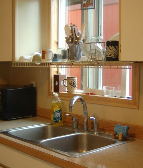 Hang a wire shelf over the sink so your dishes drip into the sink instead of onto the clean counter. Dish Strainer Ideas Drying Racks, Kitchen Sink Placement, Drying Rack Diy, Kitchen Space Savers, Sink Drying Rack, Drying Rack Kitchen, Sink Dish Rack, Diy Dish, Sink Shelf