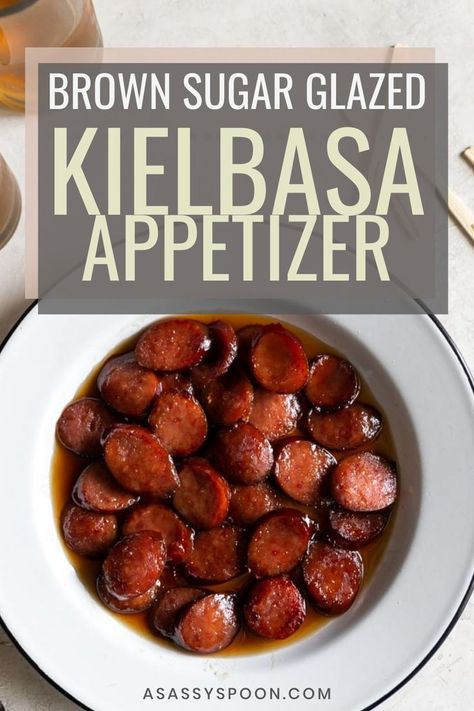 A white bowl with easy kielbasa bites in it with the words "brown sugar glazed kielbasa appetizer" in the foreground Crockpot Keilbasa Recipes, Kielbasa Bites Appetizers, Brown Sugar Kielbasa, Kielbasa Crockpot, Kielbasa Appetizer, Kielbasa Bites, Keilbasa Recipes, How To Cook Kielbasa, Slow Cooker Kielbasa