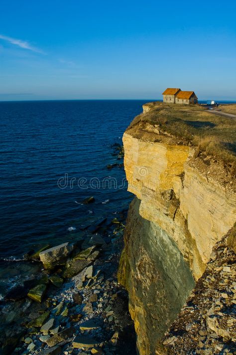 House on Cliff Edge. A small house sits overlooking the edge of a cliff. This is , #AD, #small, #house, #sits, #House, #Cliff #ad Nature, Cliff Aesthetic, House On Rock, House On Cliff, Bachelor Ideas, House On A Cliff, Cliffside House, Edge Of A Cliff, Ocean Cliff