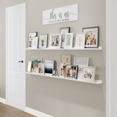 These wood shelves for walls will help you to transform any dull space into wall art! You will receive 2 narrow wall bookshelves. Install them the way you want and display your favorite pictures, family photos, and more to complete your home decor. | Latitude Run® DENVER Ledge, 84" White, 2Pcs Wood in Brown / White, Size 1.6 H x 84.0 W x 1.6 D in | Wayfair | Home Decor Wedding Photo Display Shelf, Wall Shelf Photo Display, Wood Picture Shelves, White Long Shelf, Ledge Picture Shelves, Memory Corner At Home, Floating Shelves For Photos, Floating Shelves With Frames, Floating Shelf Photo Display