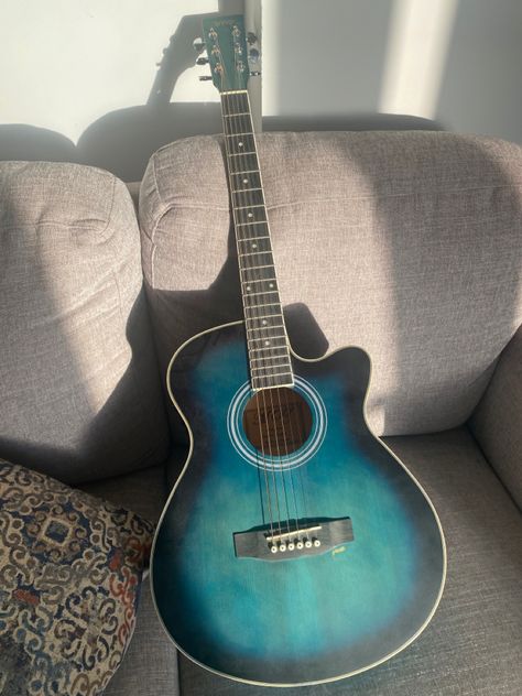 Cool blue and black acoustic guitar! #guitar #acoustic #blue #black #sunlight #trending #aesthetic Blue Acoustic Guitar Aesthetic, Blue Aesthetic Guitar, Gutair Acoustic, Pretty Acoustic Guitars, Guitar Acoustic Aesthetic, Cool Acoustic Guitars, Guitar Aesthetic Acoustic, Blue Guitar Aesthetic, Light Blue Electric Guitar