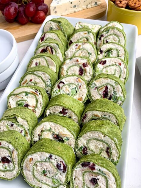 are filled with chicken, almonds, cranberries, green onions, and feta, rolled up in spinach tortillas. A great appetizer for parties -- and they taste even better than they look. As an Amazon Associate I earn from qualifying purchases. You