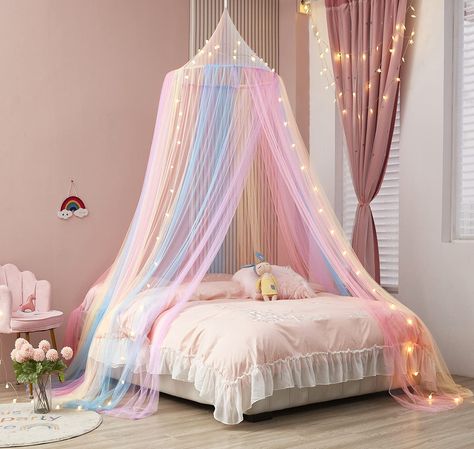 PRICES MAY VARY. Package Include:1 x Bed Canopy + 1 x Lights,height- 90”,net circumference-402” Rainbow Bed Canopy:Our bed canopy is a unique design with pink blue purple pastel color pattern.The rainbow color will brighten up your kids’ bedroom with colorful fun. Canopy For Girls Room Decor: Beautiful Rainbow Decor For Kids room decor, toddler room decor for girls, girls bedroom decor,will let your kid enjoy enough sleep with peace for the kids' sleep health. Easy To Use:All the installation ac Canopy With Lights, Room Decor Ceiling, Girls Bedroom Canopy, Bed Canopy With Lights, Rainbow Bed, Girls Rainbow Bedroom, Girls Bedroom Themes, Princess Canopy Bed, Princess Canopy