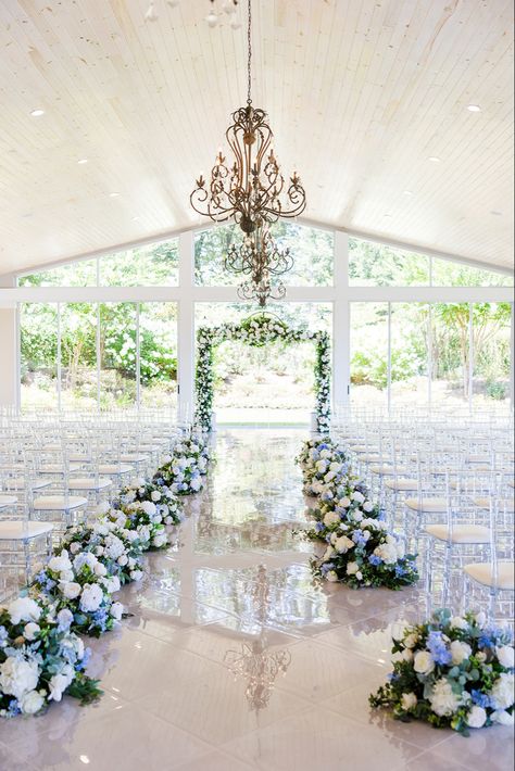 Blue White and purple florals lining the aisle at the (Tate House Wedding) Venue in Jasper Georgia white marble floors natural light wedding inspiration decor Wedding Arch Ideas Blue And White, Wedding Venues Blue And White, Inside Outside Wedding, Blue And White Aisle Arrangements, Dusty Blue Backdrop Wedding, Blue Sky Wedding Theme, Wedding Venue Blue Theme, Sky Blue And White Wedding Decorations, Light Blue Navy Blue Wedding