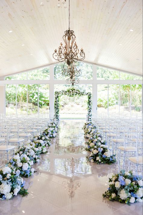 Blue White and purple florals lining the aisle at the (Tate House Wedding) Venue in Jasper Georgia white marble floors natural light wedding inspiration decor