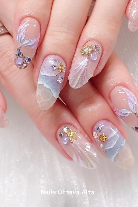 44 Gorgeous Mermaid Nails to Make You Feel like a True Ocean Goddess Nail Designs Sea Ocean, Lavender Almond Acrylic Nails, Nail Art With Crystals, Trending Almond Nails 2024, Sand Nails Design, Nature Inspired Nail Art, Ocean Nail Art Sea, Sea Witch Nails, Sea Shell Nail Designs