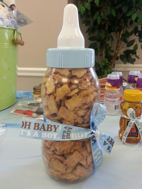 Guests guess how many teddy graham cookies are in the baby bottle Guess How Many Teddy Grahams, Teddy Graham Guessing Game, Guess How Many Teddy Grahams In A Jar, Diaper Sprinkle, Baby Boy Shower Games, Babyshower Games, Work Baby Showers, Tiffany Baby Showers, Graham Cookies