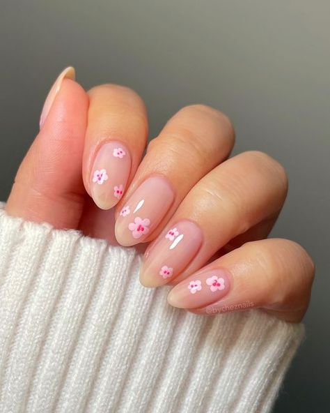 emily zheng • chez nails on Instagram: "cherry blossom nails 🌸🌸🌸 swipe for the tutorial & comment “links” to have product details sent to your DM’s! 

this nude base is stunning, it’s a new release from Cirque. I love that it’s not too pink and not too sheer. might be my new go-to 🤭

products used • pr 
💅🏼 @cirquecolors Odette, one coat over a ridge filler base coat • BYCHEZ10 to save
🌸 @ilnp Twirl
💖 @ilnp Cupid
🖌️ @twinkled_t dotting tool

ib @nailsbytaylorjustine 

#cherryblossomnails #flowernails #floralnails #springnails #springnailart #pinknails #pinknailart #cirquecolors #ilnp #twinkledt #nailtutorial #nailarttutorial spring nail inspo, flower nail art, floral nails, elegant nail art, easy nail tutorials, pink nail art, almond nails" Short Almond Nails Spring, Spring Nails Floral, Cherry Blossom Nails Art, Pink Flower Nails, Mint Green Nails, Nails Floral, Cherry Blossom Nails, Milky Nails, Cherry Nails