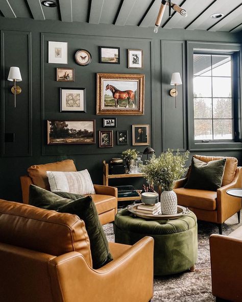 Leather Couch With Green Chairs, Hunting Lodge Interiors Ralph Lauren, Moody Green Sitting Room, Monochrome Room Paint, Dark Moody Family Room, Modern Western Bar Design, Moody Waiting Room, Caroline Willis Interiors, Dark Green Bar Room