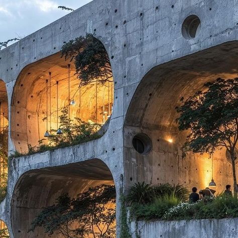 Carlos Bañon Blazquez on Instagram: "/imagine Redefining urban living in Rio, marrying the raw strength of concrete with the delicate balance of nature. It stands as a structure that respects its environment by integrating natural formations and verdure into its very essence. The result is a living space that challenges the urban jungle, replacing it with a vision of what happens when urban design celebrates nature. It’s a bold step towards a future where buildings nurture the environment they inhabit, prompting us to consider how we might all live more harmoniously with the natural world.  Series created using AI techniques. #UrbanSanctuary #NatureMeetsDesign #ModernSanctuary #InnovativeArchitecture #UrbanNatureFusion #EcoUrbanDesign #BiophilicArchitecture #SustainableUrbanism #CityscapeH Flower Tunnel, Yoga House, Biophilic Architecture, Waiting Room Design, Balance Of Nature, Urban Hotels, Natural Architecture, Architect Student, Urban Zen