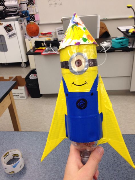 Minions, Rocket Ideas For School Project, Bottle Rocket Ideas, Water Bottle Rocket Designs, Rocket Design Ideas, Water Rocket Design, 2 Liter Bottle Rocket Designs, Rocket Projects For School, Bottle Rocket Designs