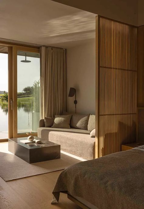 Minimalist living room at Sjöparken - a tranquil Swedish hotel with Japandi design, natural influences and a swimming lake | These Four Walls blog Japanese Temples, Oak Cladding, 2023 Picture, Traditional Japanese Architecture, Japandi Design, Japanese Temple, Hotel Concept, Hotel Room Design, Black Wall Lamps