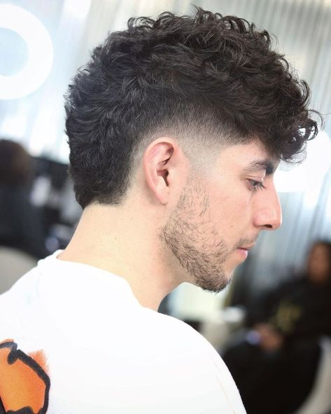 Curly Faded Hair Men, Taper Fades With Long Hair, Curly Hair Men Burst Fade, Mens Wide Mohawk Fade Haircut, Low Burst Fade Mohawk Curly Hair, Low Taper Mohawk, Seven Haircut Man, Burst Fade Messy Hair, Burst Fade Haircut Wavy Hair