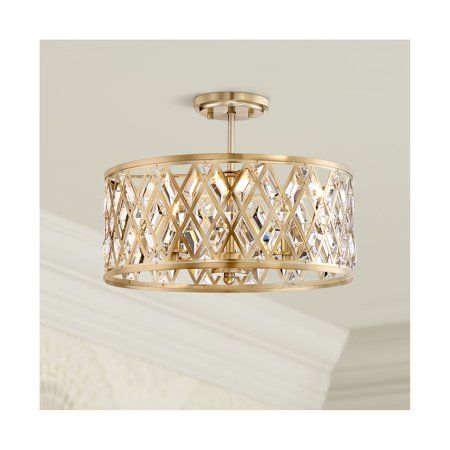 A metal drum with a geometric lattice pattern will catch your eye as the shade of this inviting satin brass ceiling light. The semi-flush design features sparkling, clear, prismatic crystal accents in the diamond-shape openings, creating a beautiful dance of of light throughout the room. This exquisite, three-light transitional fixture is from Possini Euro Design. Size: 13 x 17 x 17.  Color: Gold. Girls Bedroom Lighting, Gold Light Fixture, Farmhouse Ceiling Light, Gold Ceiling Light, Foyer Lighting Fixtures, Gold Dining, Brass Ceiling Light, White Light Fixture, Modern Ceiling Lamps