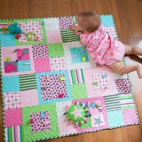 Add fun and fuction to a stroller-size quilt by sewing ribbon and rickrack loops into the blocks. Safari Baby Quilt, Fat Quarter Sewing Projects, Diy Bebe, Fat Quarter Quilt, Childrens Quilts, Baby Quilt Patterns, Baby Sewing Projects, Patchwork Quilting