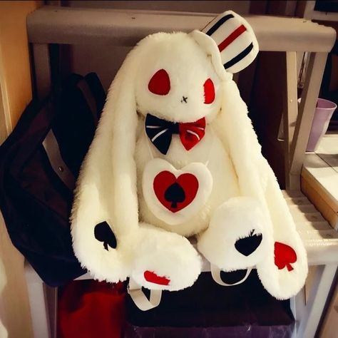 This creepy cute white rabbit plush backpack is a must have for any kawaii babe with a love for dark gothic fashion, with a kawaii twist!  Featuring a sweet long-eared bunny with red eyes, a stitched up mouth, and black and white bow tie as well as poker playing card embroidery all over! Cheeky, cute, and slightly evil Creepy Stuffed Animals, Istoria Modei, Doll Backpack, White Bow Tie, Kawaii Bunny, Plush Bags, Plush Backpack, Kawaii Plush, Kawaii Plushies