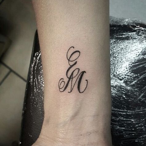 E and M 1st #tattos #tattooed #tattooing #lettering #letteringtattoo #letters #calligraphy #black #e #m Molde, Initial Wrist Tattoos, Monogram Tattoo, Tattoo Homme, Ems Tattoos, Letters Calligraphy, 7 Tattoo, Favorite Tattoos, M Tattoos