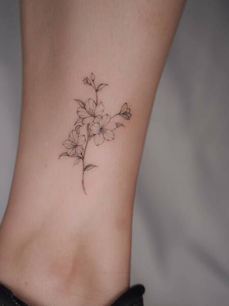 Simple Cherry Blossom Tattoo Feminine Cherry Blossom Tattoo, Azaleas Flower Tattoo, Tulip And Cherry Blossom Tattoo, Minimalist Tattoo Cherry Blossom, Cheery Blossoms Tattoo Japanese, Dainty Flower Ankle Tattoo, Breathe Flower Stem Tattoo, Small Japanese Cherry Blossom Tattoo, Fine Line Azalea Tattoo