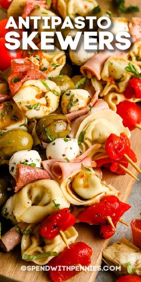 Antipasto Skewers are a fun, elegant way to serve appetizers at a party! Favorite meats, cheeses, tortellini, and olives are skewed and served with red or white wine! #spendwithpennies #antipastoskewer #recipe #appetizer #easy #italian Mini Antipasto Skewers, Tuscany Appetizers, Food To Serve At A Party, Appetizer Recipes With Meat, Tortellini Kabobs Antipasto Skewers, Cheese And Meat Skewers, Red Party Food, Meat And Cheese Skewers, Tortellini Skewers