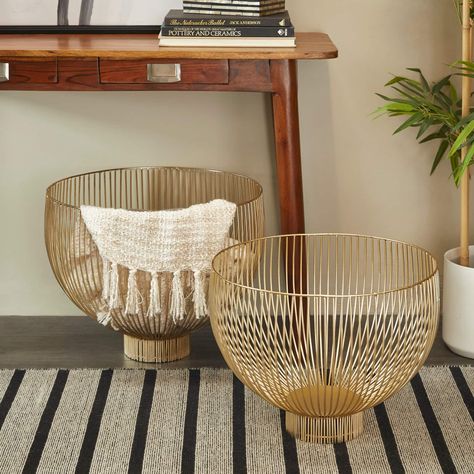 "Buy the Gold Metal Caged Style Decorative Bowl Set at Michaels. com. Modern metal wire bowls are crafted with solid iron for an elegant yet durable structure. Modern metal wire bowls are crafted with solid iron for an elegant yet durable structure. Metallic gold finish highlights the minimalist design of this decorative basket set for an opulent and stunning look. These decorative bowls feature design and function with wide openings for table décor fillers or storage. Details: Gold colored Incl Gold Basket Decor, Mixed Metals Decor, Gold Basket, Decorative Basket, Metal Bowl, Metal Baskets, Decorative Bowl, Basket Sets, Table Style