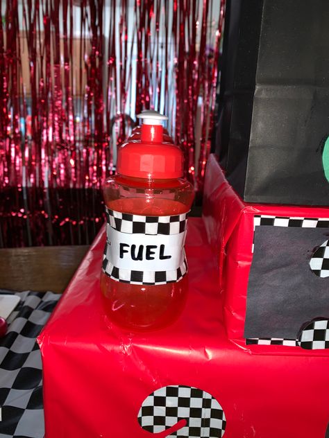 Bottles used as “fuel” for drinks. I got these cute little bottles at dollar tree Tokyo Drift Party Theme, Race Car Theme Party, Party Table Ideas, Car Theme Party, Race Car Themes, Car Themed Parties, Tokyo Drift, Car Theme, Cars Theme Birthday Party