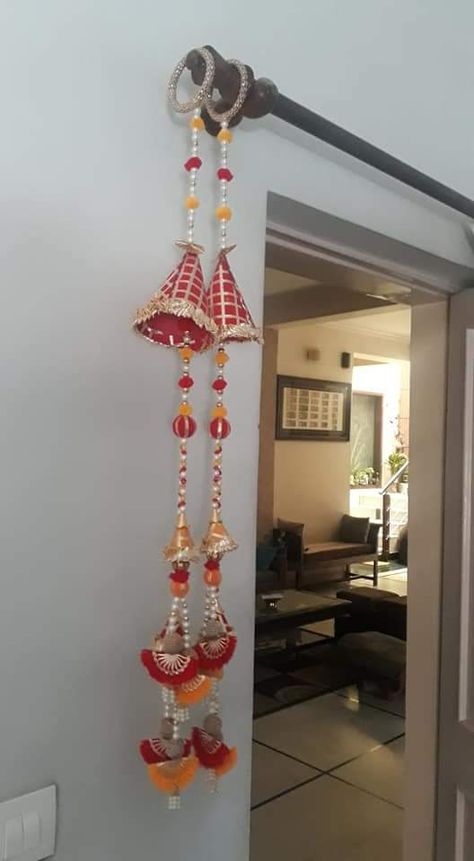 Jain Parna Decoration, Side Door Hanging For Diwali, Door Latkan Designs, Side Hangings For Diwali, Door Side Hangings Toran, Rajasthani Decoration, Diwali Candles, Door Hanging Decorations, Paper Flower Garlands