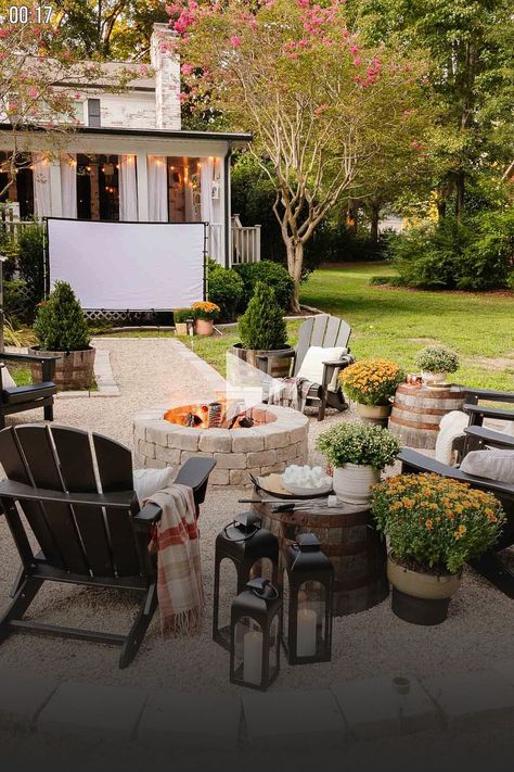 ✓ Ideas to host a backyard movie night with a list of over 100 best outdoor movies for all ages recommended equipment...acks...d seating. garden art drawing, garden art ideas, garden art diy whimsical, Fire Pit Storage, Outdoor Movie And Fire Pit, Cozy Fall Party Ideas, Back Deck Fall Decorating Ideas, Fire Pit Decor Ideas, Fire Pit Area Decor, Large Fire Pit Ideas Backyard, Firepits Backyard Ideas Fall, Fall Fire Pit Decor