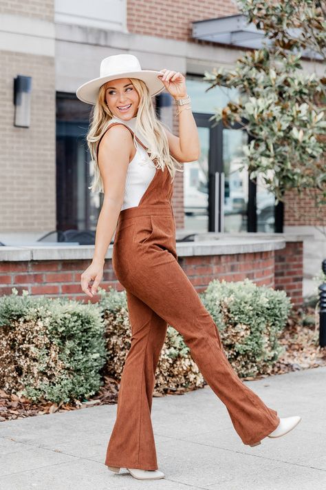 Details Brown corded overalls Zip front Flare leg Pair this with a bodysuit and your favorite boots! Unlined Material and Care 95% Polyester / 5% Spandex Wash / dry instructions Machine wash cold, hang to dry Materials may have natural variations Colors may vary from different viewing devices. Poses In Dungaree, Cute Pumpkin Patch Outfits, Pumpkin Patch Outfit Women, Pumpkin Patch Outfits, Cow Pics, Pumpkin Patch Photoshoot, Patch Outfit, Thanksgiving Outfit Women, Dark Wash Flare Jeans