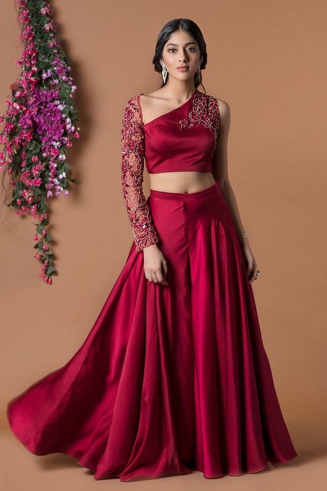 Lehenga Blouse Designs One Shoulder, Crop Tops With Lehenga, Crop Top With Pants Indian, Blouse With Belt For Lehenga, Sleeves Design For Crop Top, Red Crop Top Lehenga Party Wear, One Shoulder Blouse Designs For Lehenga, Embroidery Crop Top Designs, Blouse Design For Lehenga Crop Tops