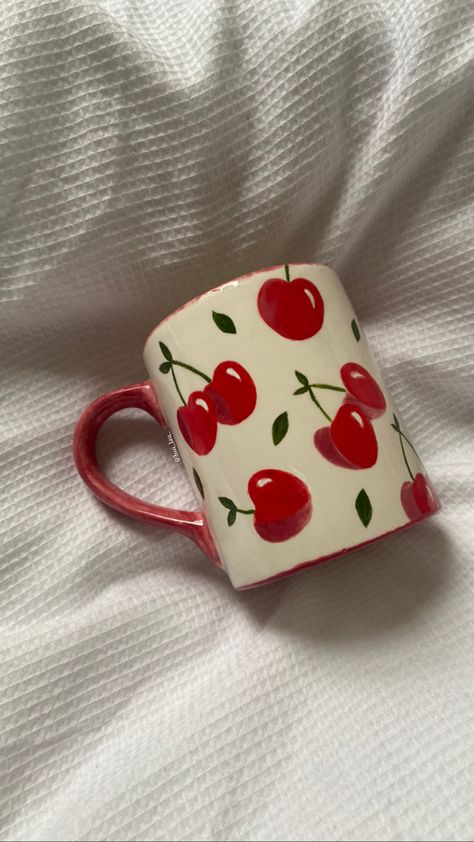 painted cherry mug on duvet Cherry Mug Painting, Painting On Cups Ideas, Easy Cup Painting Ideas, Aesthetic Cup Painting, Paint On Mugs Diy, Diy Cup Painting, Painted Pottery Vase Ideas, Pottery Painting Inspo Fruit, Pottery Painting Fruit Design