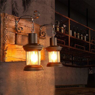 The wall lamp is designed in a mid-world vintage style, with unique old workmanship. Glass lantern lampshade, durable metal in black, and natural solid wooden backplate give it a rustic yet modern appearance as well as enhance the timeless design and durable use. Fit most decor styles. Perfectly suitable for industrial style, loft-style, retro style, and modern style. | FRONG 2-Lights Vintage Metal Lantern Wall Lamp w / Wood Backplate & Glass Lampshade Glass / Metal in Black | 12.99 H x 21.65 W Pirate Office, Lantern Lampshade, Whiskey Lounge, Rustic Wall Lighting, Cylinder Lights, Wedding Forest, Old Lanterns, Vintage Wall Sconces, Vintage Wall Lights