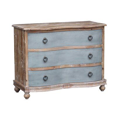 Swedish-inspired chest is made of reclaimed solid pine with a grey hand-painted finish and natural drawers. Curvy-shaped front, three drawers, and bun feet. Aged brass drawer pulls with the ring. Reclaimed pine, by nature, is apt to have knots and imperfections adding charm and character and should be expected with this item. | Gracie Oaks Steffi 3 Drawer 43.5" Solid Wood Dresser Brown 34.0 x 43.5 x 20.0 in | GRKS8195_56851027 | Wayfair Canada Adding Bun Feet To Furniture, Nature, Two Tone Furniture Painting Wood, Distressed Painted Furniture, Blue Painted Dresser, Two Tone Furniture, Dresser Brown, Dresser Wood, Solid Wood Dresser