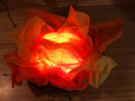 Easy Fake Fire Prop Tutorial for Halloween - Fright At Home How To Make Fake Fire With Tissue Paper, Fire Halloween Decorations, Fake Fire Flames, Fake Fire In Fireplace, Fake Fire Under Cauldron, Tissue Paper Fire Flames, Fake Flames Diy, Fake Fire Diy, How To Make A Fake Fire