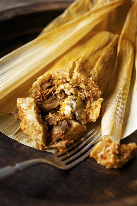 Borracho.  This giant tamale that is almost a pound in weight, is filled with a spicy chicken filling, fresh slices of jalapeño and cream cheese.  The name of this tamale in Spanish means Drunkard!  It is so spicy and full of flavor that it is a perfect remedy to get any drunkard past their hang over. Tamales Photography, Mexican Tamales, Giant Chicken, Bbq Marinade, Tamale Recipe, Hot Tamales, Red Chili, Tamales, Hang Over