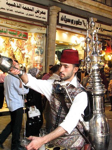 cold drink sold in Souk Al-Hamidiya, Damascus, Syria.  Photo: aniarenia via Flickr. Syria Culture, Syrian Clothing, Syrian Culture, Syria Before And After, Syrian Flag, Aleppo City, Damascus Syria, World Street, Arab Culture