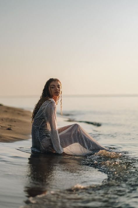 A sunrise beach editorial photoshoot for summer that is sure to inspire you and make you want to hit the beach at sunrise yourself! #fashioneditorial #editorialphotography #beacheditorial #sunrisephotoshoot #editorialpictures #photographyinspiration Wet Look Beach Photoshoot, Beach Morning Photoshoot, By The Water Photoshoot, Vogue Water Photoshoot, Fashion Editorial Aesthetic, Beach In Water Photoshoot, Chair On Beach Photoshoot, Beach Editorial Shoot, Editorial Water Photoshoot